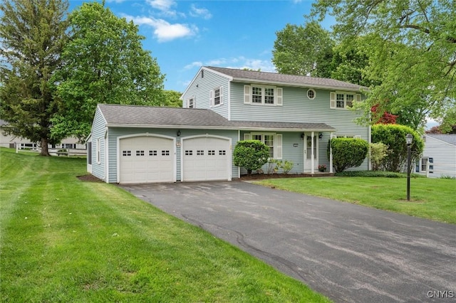 104 Hillside, Camillus, NY 13031 - traditional home featuring an attached garage, driveway, and a front lawn