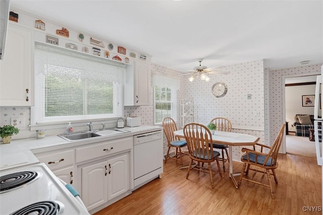 104 Hillside, Camillus, NY 13031 - kitchen with wallpapered walls, white appliances, a sink, light wood finished floors, and white cabinetry