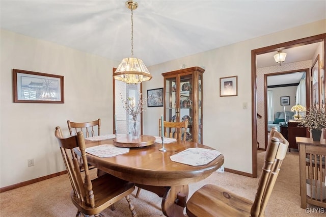 104 Hillside, Camillus, NY 13031 - dining room with light colored carpet, a chandelier, and baseboards