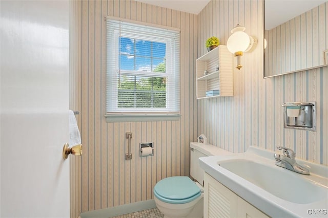 104 Hillside, Camillus, NY 13031 - bathroom featuring wallpapered walls, toilet, and vanity