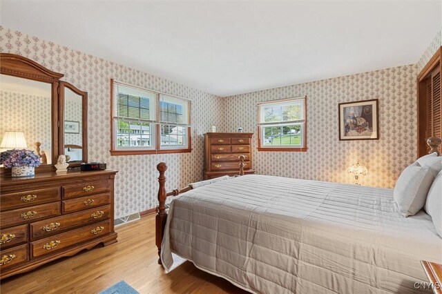 104 Hillside, Camillus, NY 13031 - bedroom featuring light wood-style floors and wallpapered walls