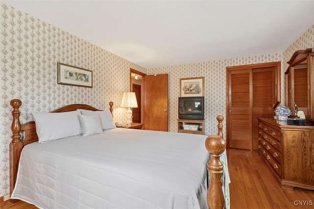 104 Hillside, Camillus, NY 13031 - bedroom with wallpapered walls and wood finished floors