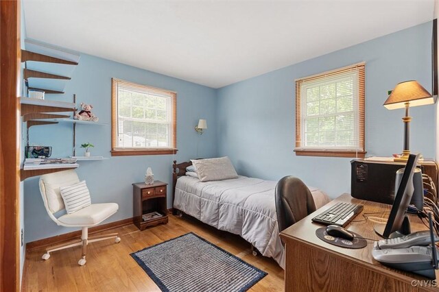 104 Hillside, Camillus, NY 13031 - bedroom featuring multiple windows, wood finished floors, and a desk
