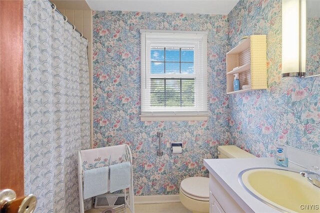 104 Hillside, Camillus, NY 13031 - full bathroom with baseboards, toilet, vanity, wallpapered walls, and a shower with curtain
