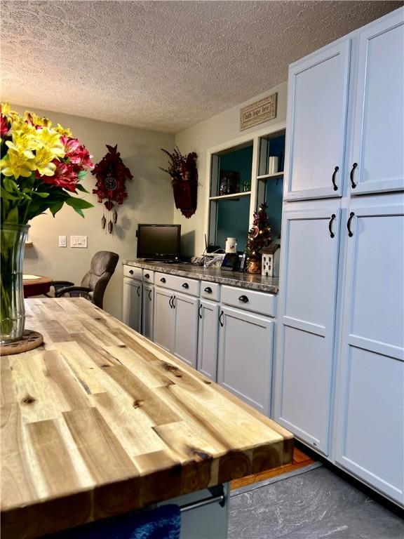4600 College Ave, Corning, NY 14830 - dining space featuring a textured ceiling
