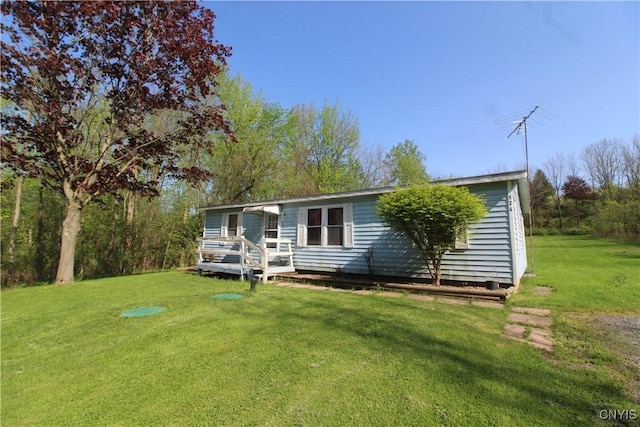 574 Eno Rd, Elbridge, NY 13080 - view of front of property featuring a front yard and a wooden deck