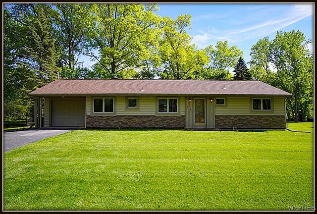 458 Kenwood Dr, Lewiston, NY 14092 - ranch-style house with an attached garage, stone siding, a front yard, and asphalt driveway