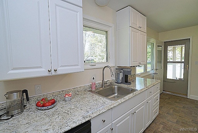 458 Kenwood Dr, Lewiston, NY 14092 - kitchen featuring a sink, white cabinetry, stone finish floors, and light stone countertops