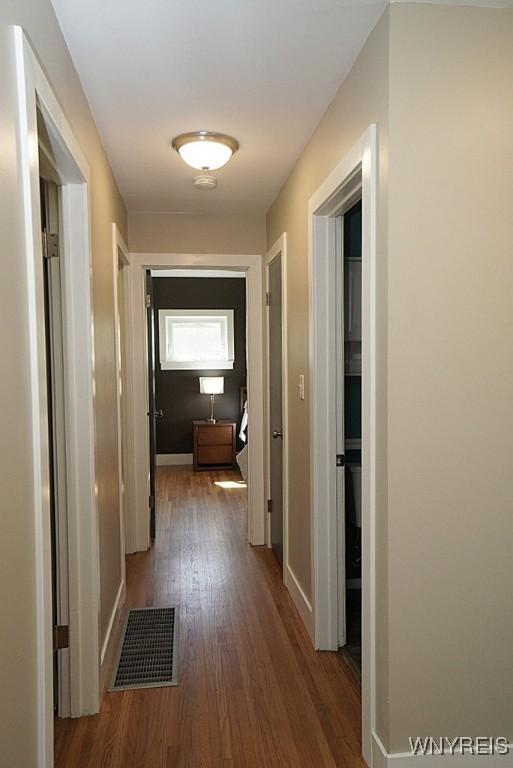 458 Kenwood Dr, Lewiston, NY 14092 - hall with wood finished floors and baseboards