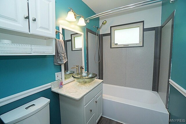 458 Kenwood Dr, Lewiston, NY 14092 - bathroom featuring shower / bathtub combination, toilet, vanity, and wood finished floors