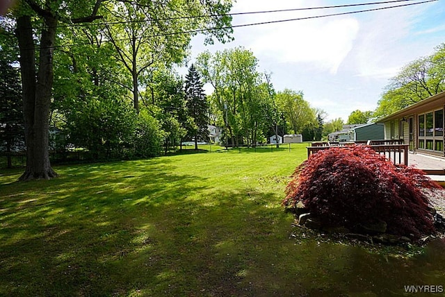 458 Kenwood Dr, Lewiston, NY 14092 - view of grassy yard with a deck