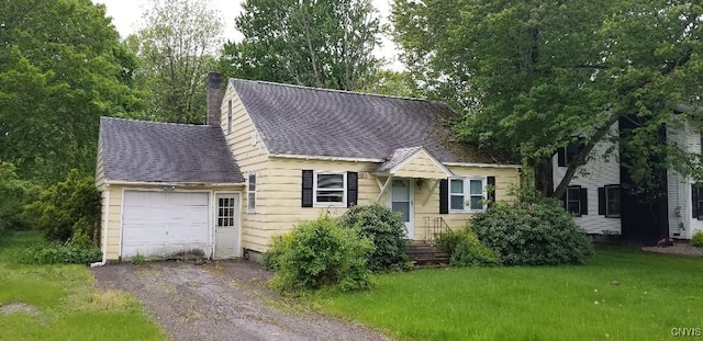 5986 Smith Rd, Cicero, NY 13212 - view of front of home featuring a garage, a chimney, driveway, a front lawn, and a shingled roof