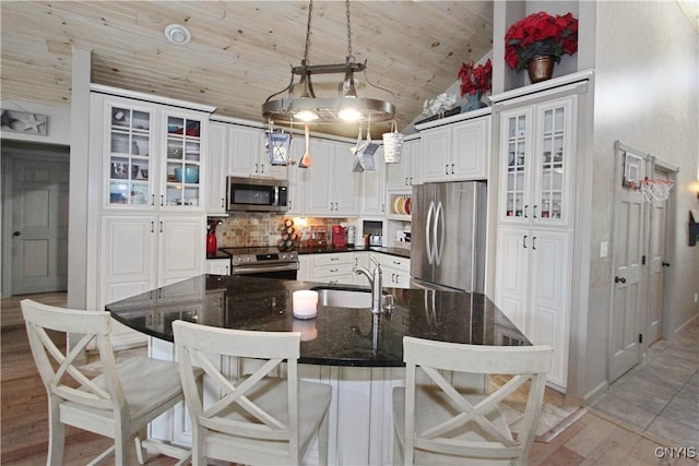 7030 Peckham Rd, Watson, NY 13367 - kitchen featuring stainless steel appliances, a sink, decorative backsplash, white cabinetry, and wood ceiling