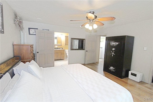 7030 Peckham Rd, Watson, NY 13367 - bedroom featuring light wood-style floors, a ceiling fan, and ensuite bathroom