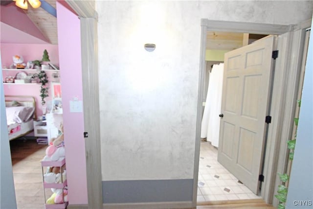 7030 Peckham Rd, Watson, NY 13367 - hallway with lofted ceiling and light flooring
