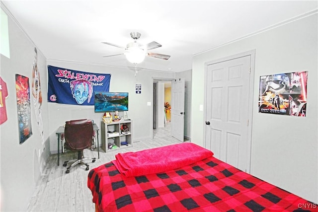 7030 Peckham Rd, Watson, NY 13367 - bedroom with wood finished floors, baseboards, and a ceiling fan