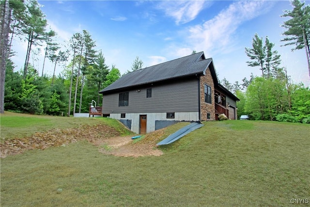 7030 Peckham Rd, Watson, NY 13367 - view of property exterior featuring a yard and a deck