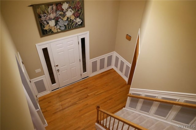 7899 E Ridge Pointe Dr, Manlius, NY 13066 - foyer entrance featuring wood finished floors, a decorative wall, and a wainscoted wall