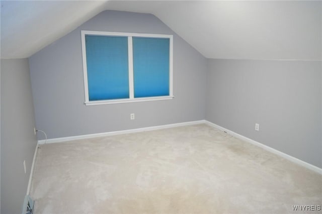 7899 E Ridge Pointe Dr, Manlius, NY 13066 - additional living space with lofted ceiling, carpet, and baseboards