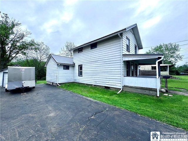108 S Main St, Evans, NY 14006 - view of property exterior with a lawn and driveway