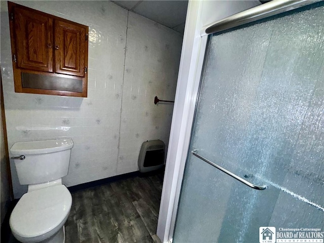108 S Main St, Evans, NY 14006 - bathroom with wood finished floors, a shower stall, toilet, and heating unit
