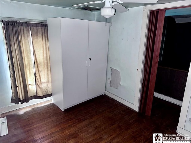 108 S Main St, Evans, NY 14006 - unfurnished bedroom with dark wood finished floors
