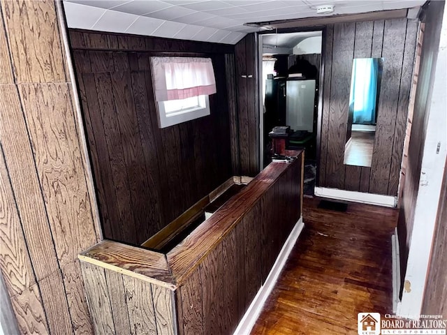 108 S Main St, Evans, NY 14006 - hall featuring wooden walls, hardwood / wood-style floors, and lofted ceiling
