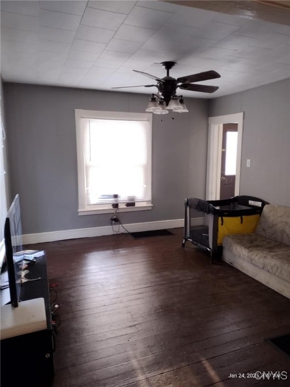 70 Prospect Ave, German Flatts, NY 13357 - unfurnished living room featuring a ceiling fan, healthy amount of natural light, and hardwood / wood-style floors