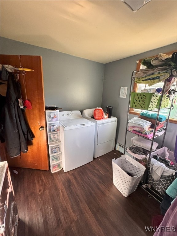 2746 Johnson Creek Rd, Hartland, NY 14105 - washroom featuring separate washer and dryer, dark wood finished floors, and baseboard heating