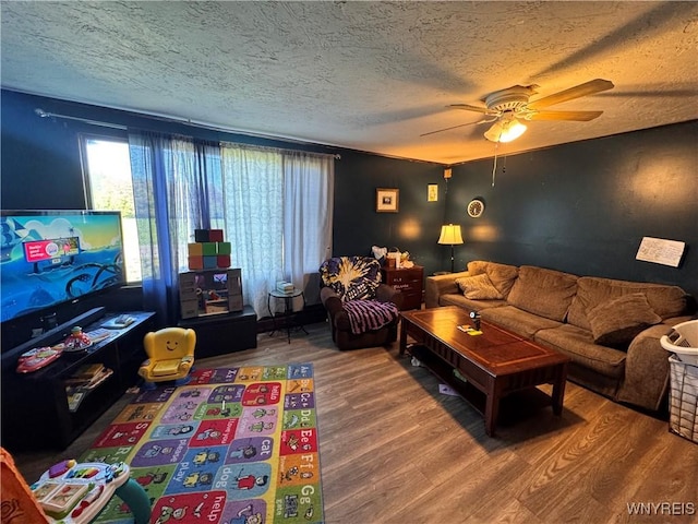 2746 Johnson Creek Rd, Hartland, NY 14105 - living room featuring wood finished floors, a textured ceiling, and ceiling fan