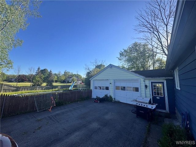 2746 Johnson Creek Rd, Hartland, NY 14105 - garage with asphalt driveway