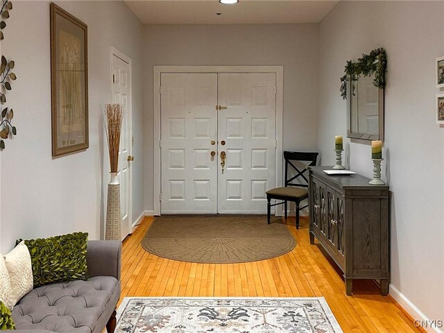 10 Foery Dr Unit 404, Utica, NY 13501 - foyer with light wood finished floors and baseboards