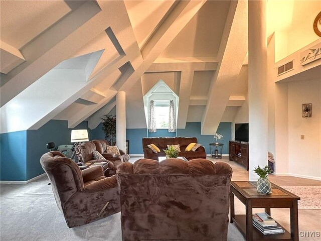 10 Foery Dr Unit 404, Utica, NY 13501 - living area featuring baseboards, light colored carpet, beam ceiling, and high vaulted ceiling
