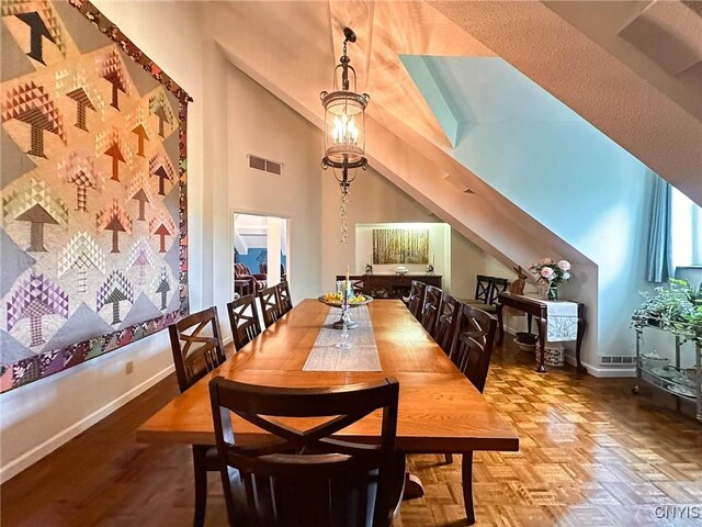 10 Foery Dr Unit 404, Utica, NY 13501 - dining space with baseboards and lofted ceiling