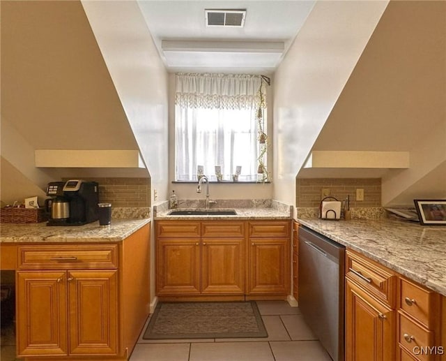 10 Foery Dr Unit 404, Utica, NY 13501 - kitchen with a sink, stainless steel dishwasher, and brown cabinets