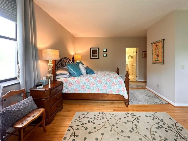 10 Foery Dr Unit 404, Utica, NY 13501 - bedroom with light wood finished floors and baseboards