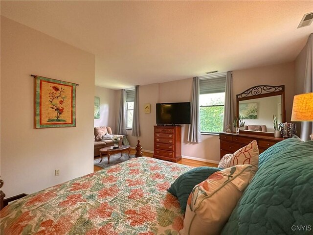 10 Foery Dr Unit 404, Utica, NY 13501 - bedroom with wood finished floors