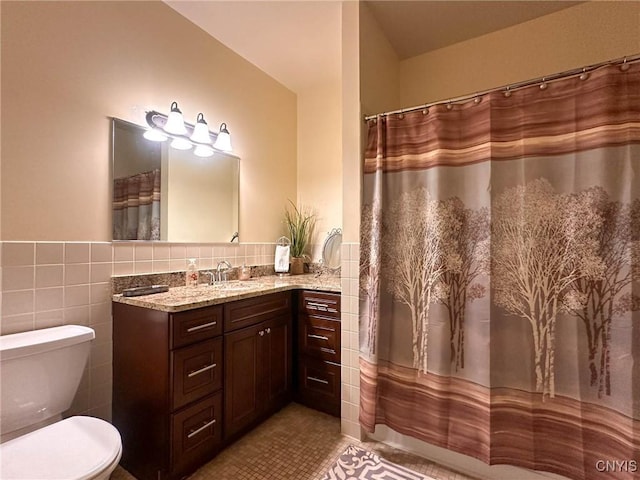 10 Foery Dr Unit 404, Utica, NY 13501 - bathroom with vanity, toilet, tile patterned flooring, tile walls, and curtained shower