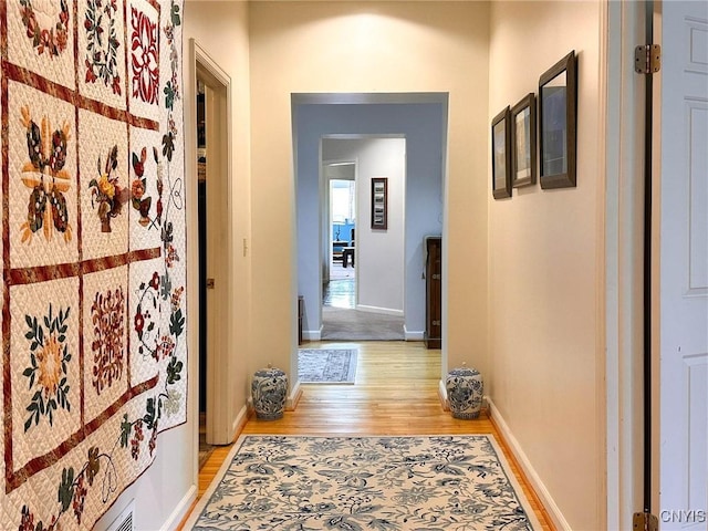 10 Foery Dr Unit 404, Utica, NY 13501 - hall featuring light wood finished floors and baseboards