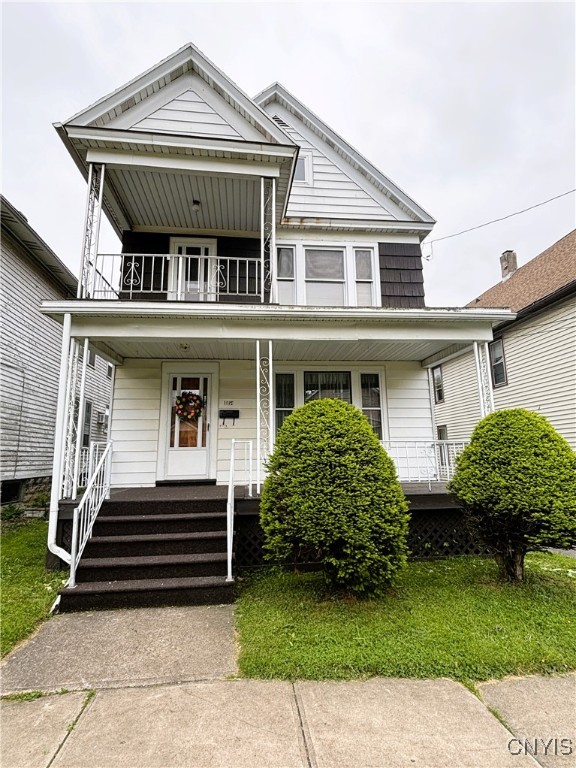 view of front of house featuring a balcony and a porch