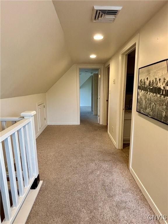 additional living space with carpet floors, recessed lighting, and lofted ceiling