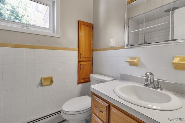 1681 Amherst St, Buffalo, NY 14214 - bathroom with baseboard heating, tile walls, toilet, and vanity