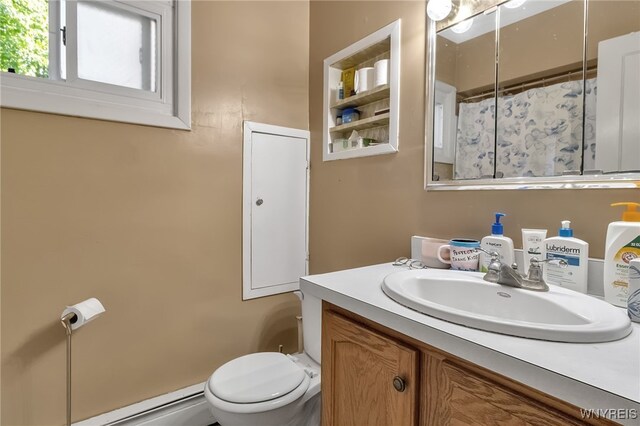 1681 Amherst St, Buffalo, NY 14214 - full bath featuring a baseboard radiator, toilet, and vanity