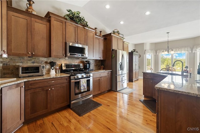 146 Edwards Falls Ln, Manlius, NY 13104 - kitchen featuring appliances with stainless steel finishes, a sink, light wood-type flooring, recessed lighting, and tasteful backsplash