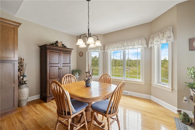 146 Edwards Falls Ln, Manlius, NY 13104 - dining area featuring light wood-type flooring, baseboards, and a chandelier