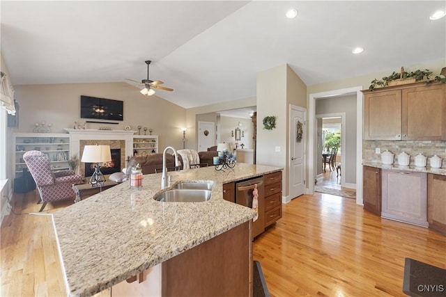 146 Edwards Falls Ln, Manlius, NY 13104 - kitchen with a sink, a high end fireplace, dishwasher, ceiling fan, and light wood-style floors