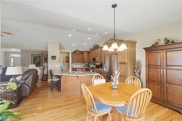 146 Edwards Falls Ln, Manlius, NY 13104 - dining area with lofted ceiling, light wood-style flooring, a chandelier, recessed lighting, and a ceiling fan