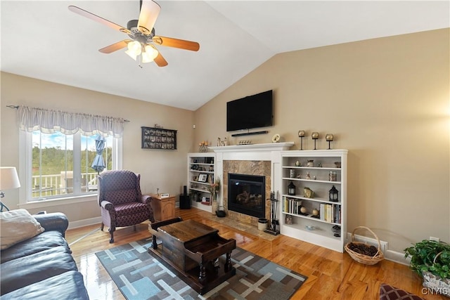 146 Edwards Falls Ln, Manlius, NY 13104 - living room with ceiling fan, a fireplace, lofted ceiling, wood finished floors, and baseboards