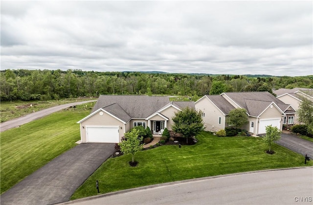 146 Edwards Falls Ln, Manlius, NY 13104 - ranch-style house featuring driveway, an attached garage, a front yard, and a wooded view
