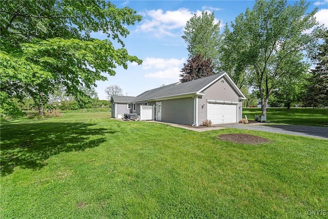 3616 E Genesee St Rd, Sennett, NY 13021 - view of front of property featuring a garage, driveway, a front yard, and an outbuilding